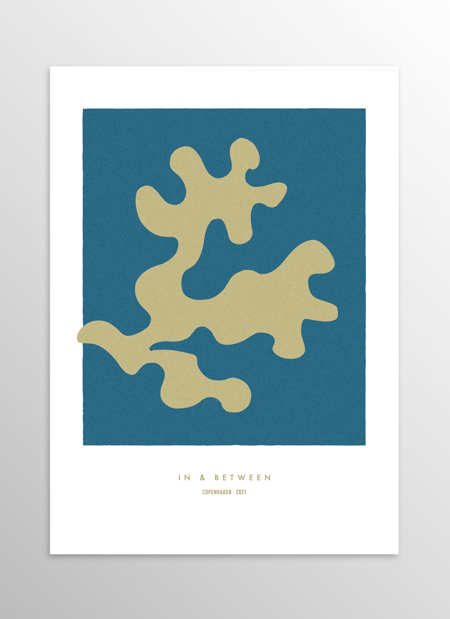 Art print of golden oak leaf on dark blue background.