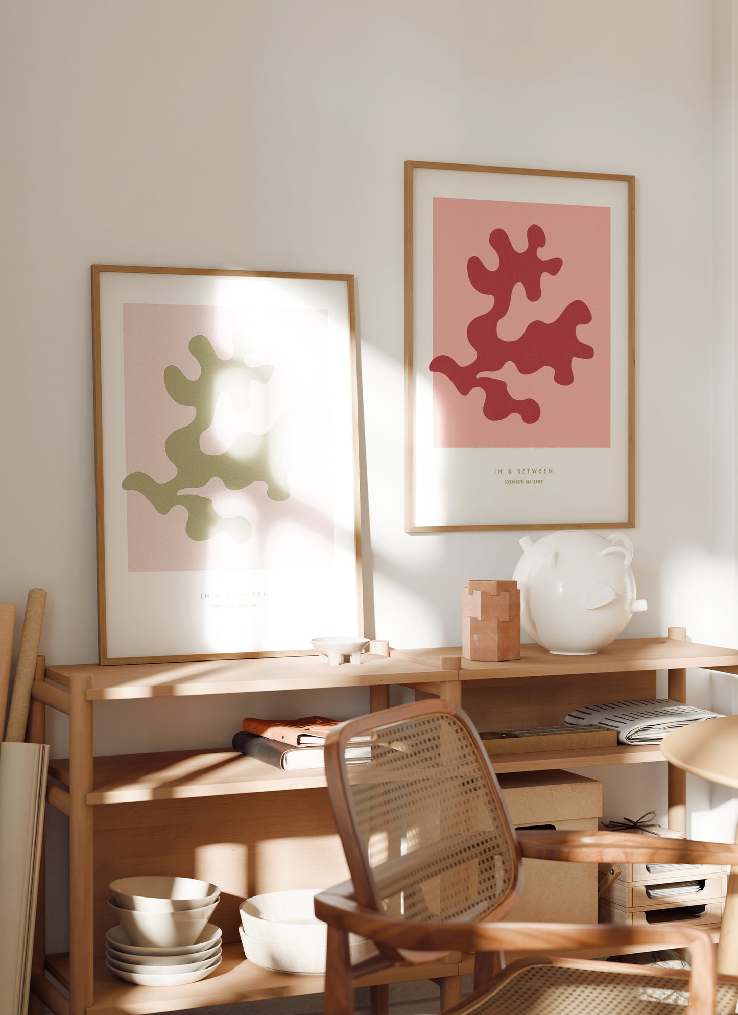 Art print of strawberry ice red oak leaf and background in natural wooden frame hanging on wall in a room setting.