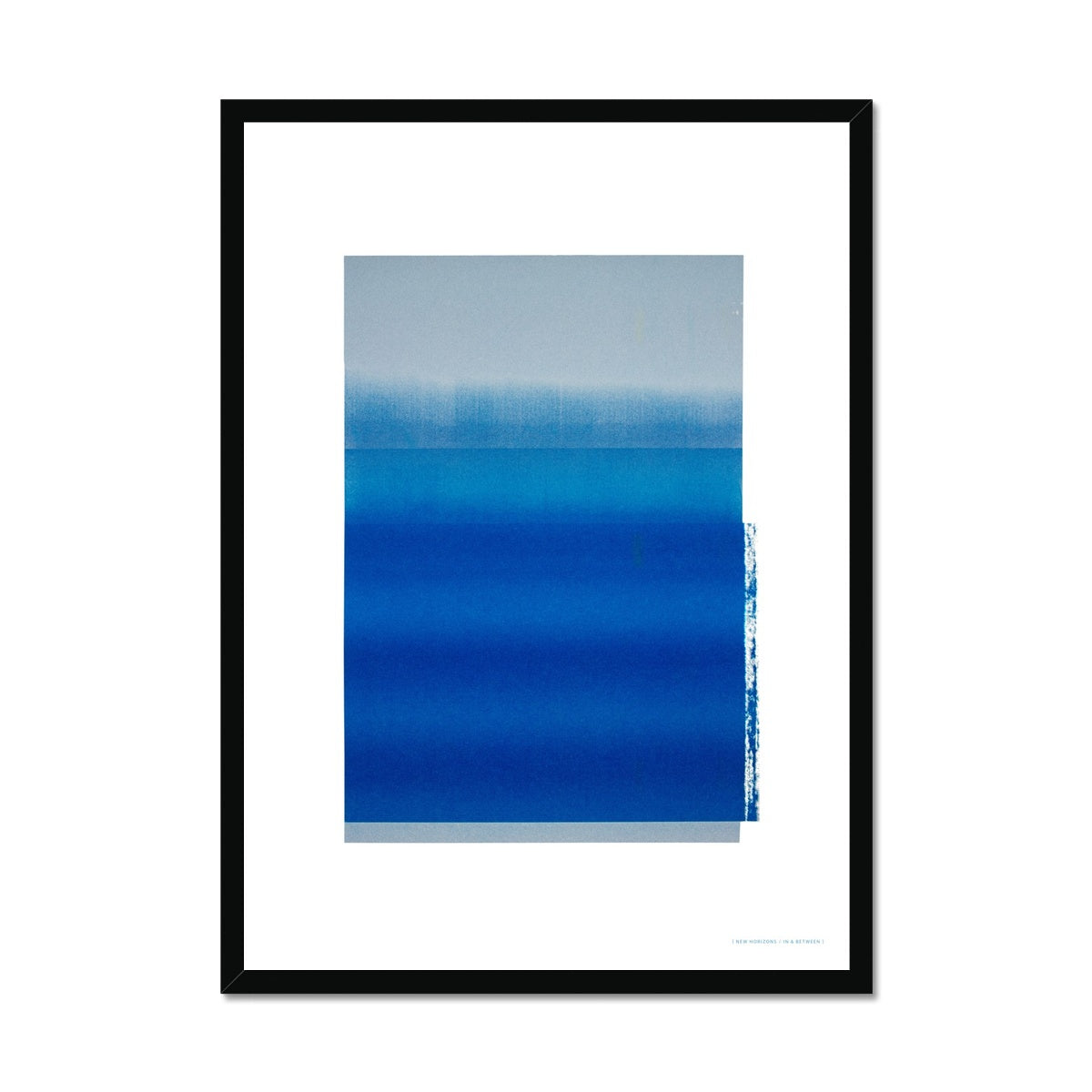 Black wood framed giclee print depicting a vibrant blue horizon within a wide white border. From being completely saturated at the bottom the pigments of colour slowly spread out upwards until it fades into space at the top like the horizon.