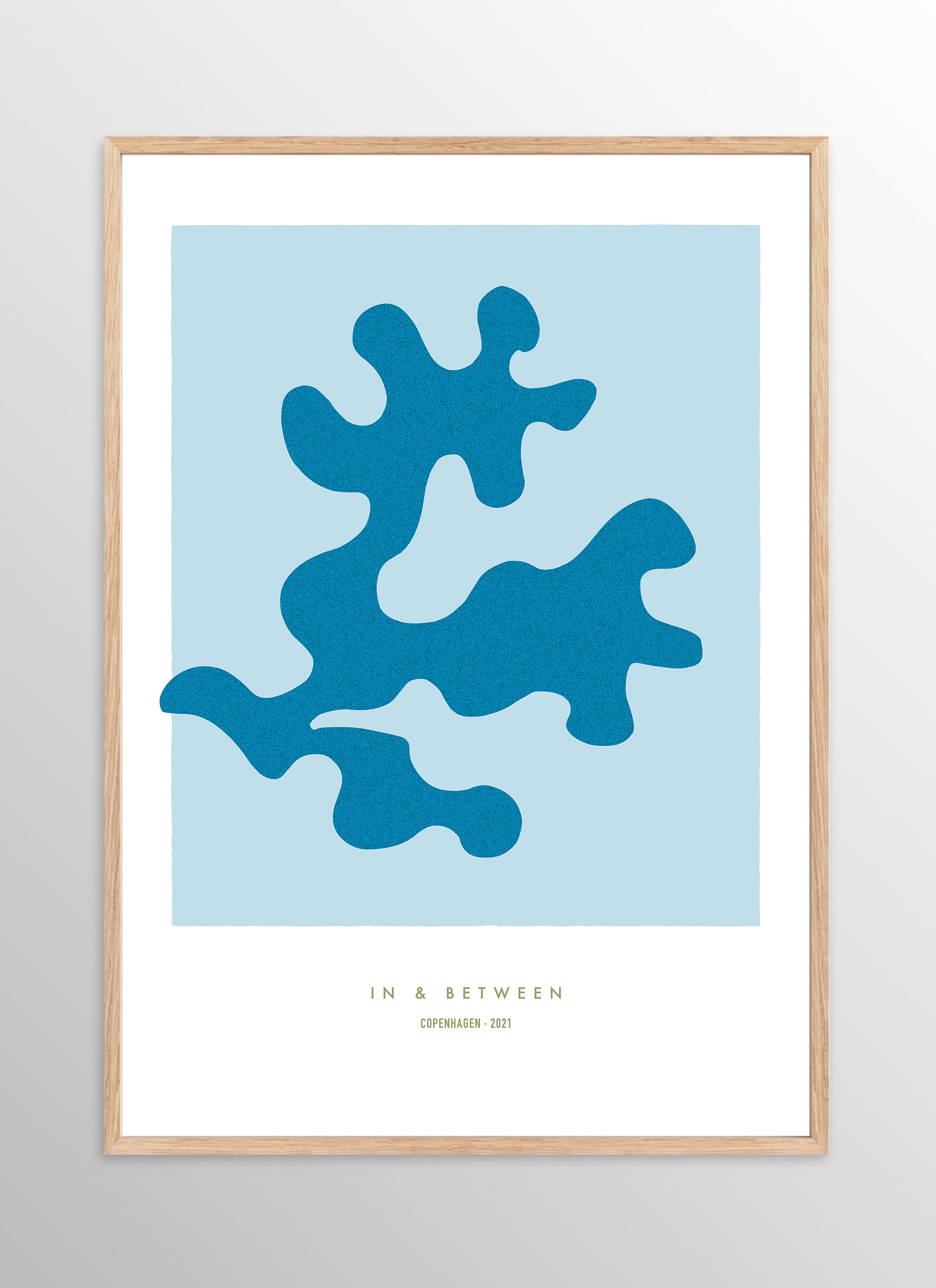 Art print oak leaf and background in light blue in natural wooden frame.