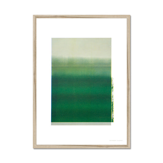 Natural wood framed giclee print depicting deep green horizon within wide white border. From being completely saturated at the bottom the pigments of colour slowly spread out upwards until it fades into space at the top like the horizon.