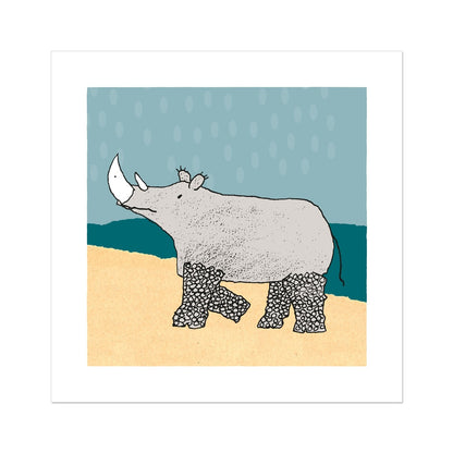 Art print of rhino with patterned legs in pale yellow and teal landscape and pale blue sky with large raindrops.