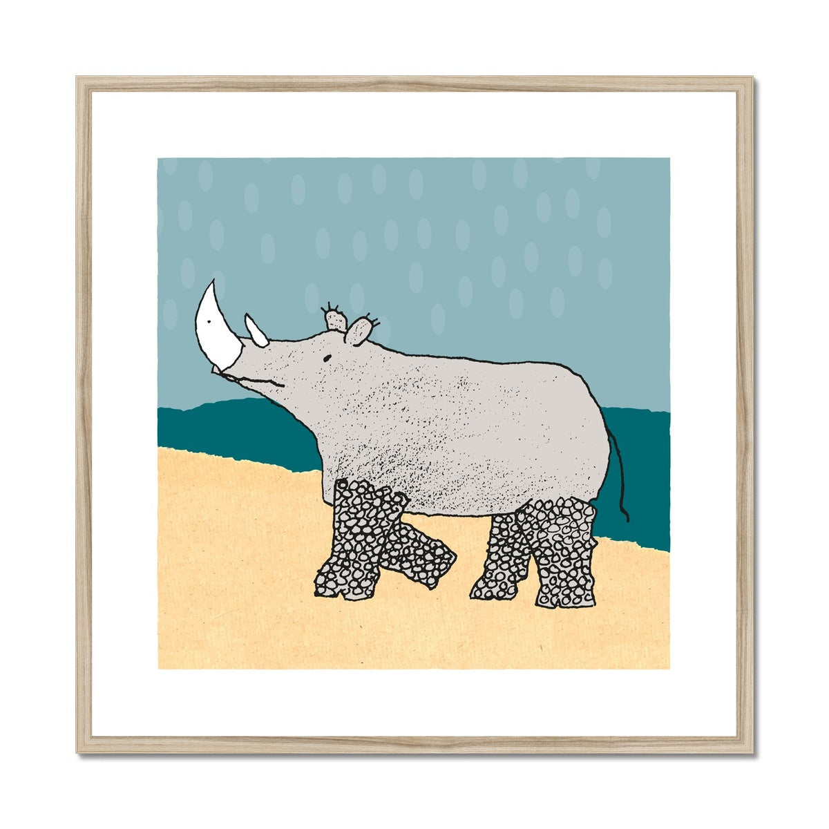 Art print of rhino with patterned legs in pale yellow and teal landscape and pale blue sky with large raindrops in a natural wooden frame.