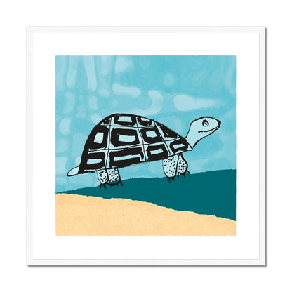 Art print of happy tortoise in pale yellow and teal landscape with blue sky in a white wooden frame.