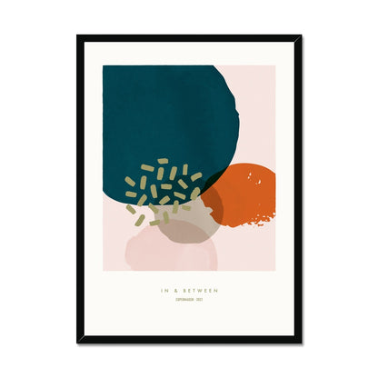 Soft abstract partly overlapping circles in teal, rust and pink with structure details on a cream background set with white space around in a black wooden frame.