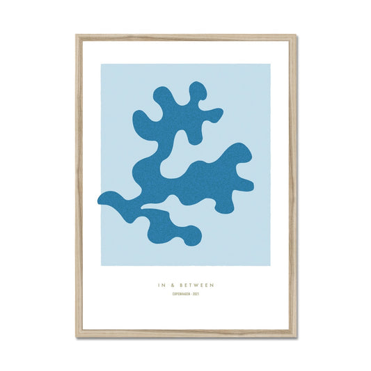 Art print of soft blue oak leaf on light blue background with white space around in natural wooden frame.
