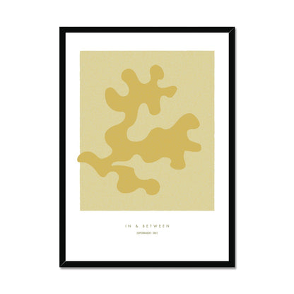 Art print of maple coloured oak leaf on a lighter maple background with white space around in black wooden frame.